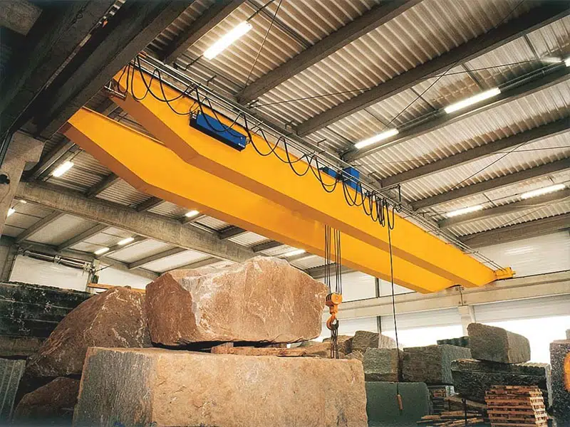 overhead crane lifts rocks